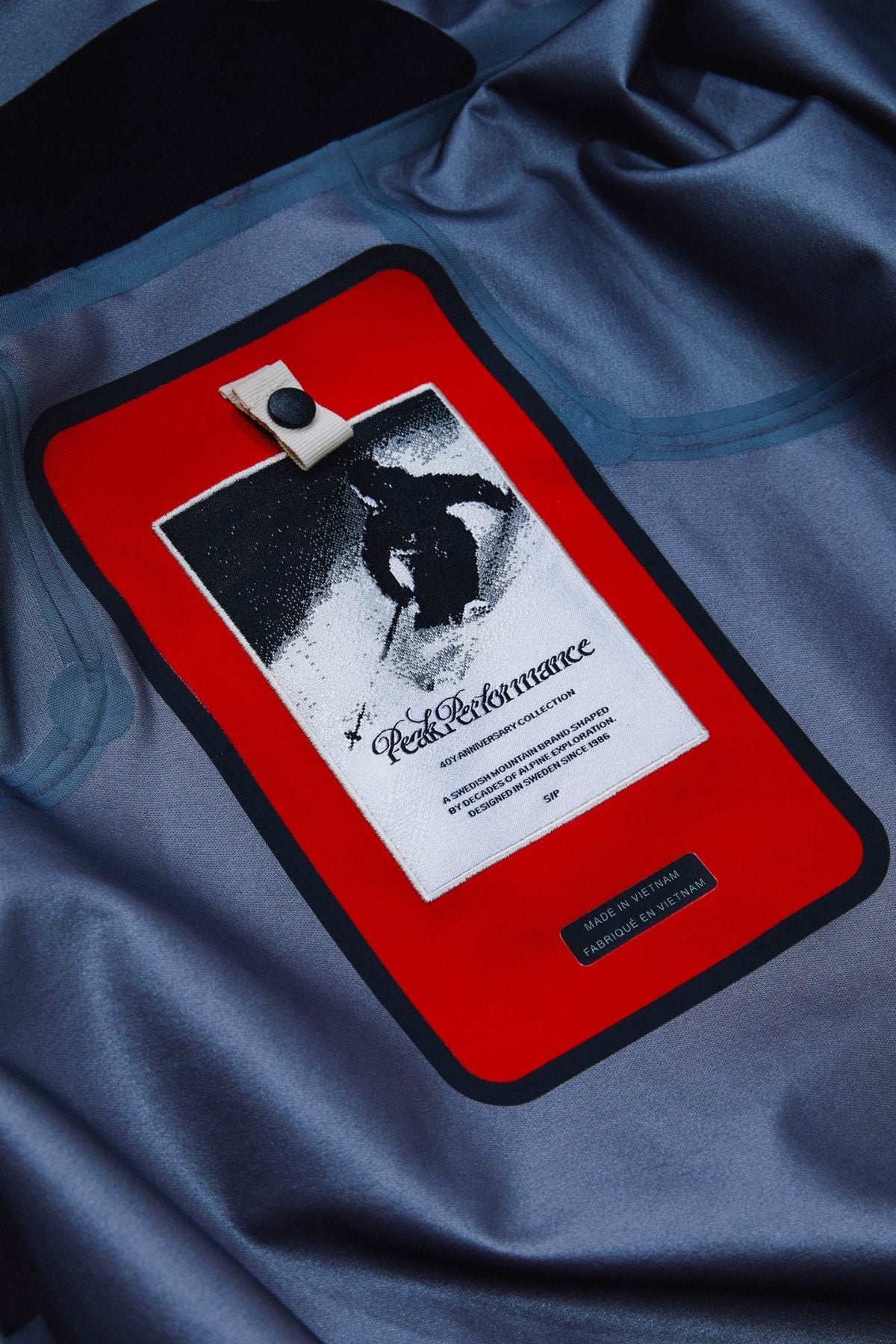 The anniversary label inside a shell jacket